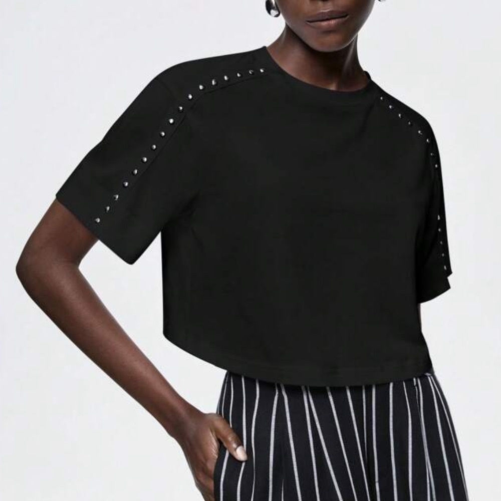 black tee shirt with silver studded sleeve embellishments